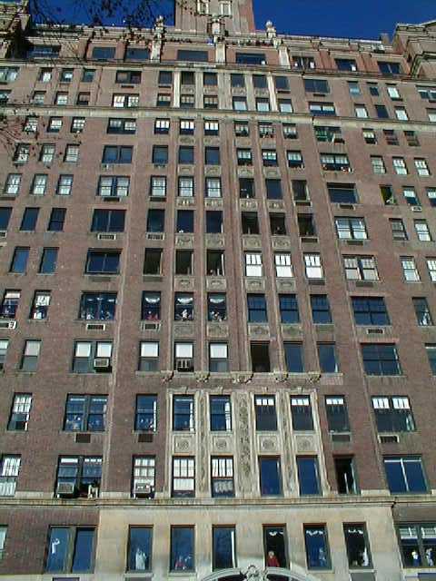 People viewing parade from apartment building